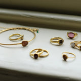 Ram Rijal '24ct Gold bangle with tourmaline'