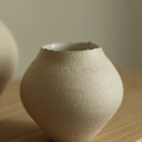 'Extra small stoneware vessel with a bare exterior and a white glaze interior' 2