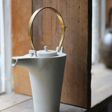 Kin Leung Grog porcelain white teapot with a brass handle