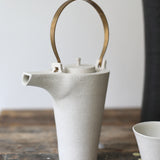 Kin Leung Grog porcelain white teapot with a brass handle