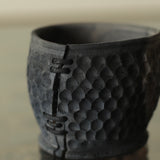 Glenn Dane 'Hollowed cup from sustainably sourced maple, with iron oxide, hand carved facets & stitch mending'